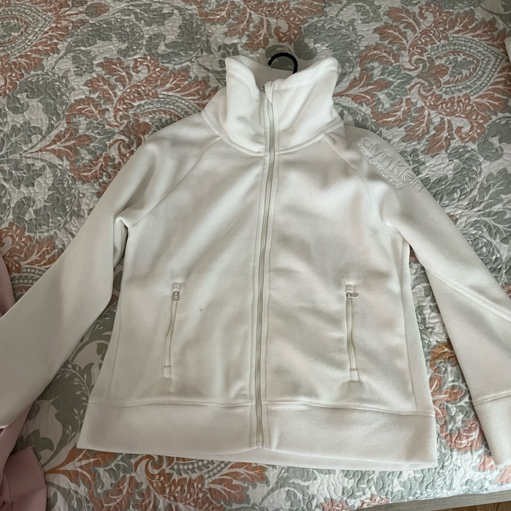 Calvin Klein zip up sweater in the color white size large